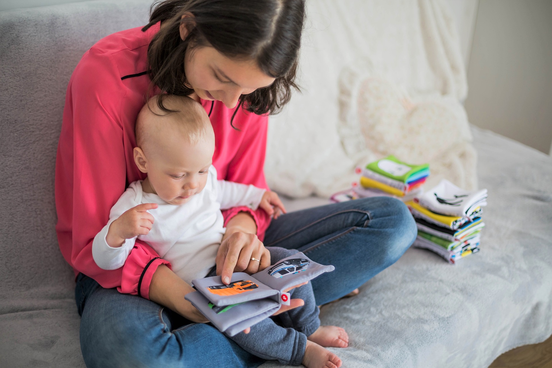 mother reading infant child baby
